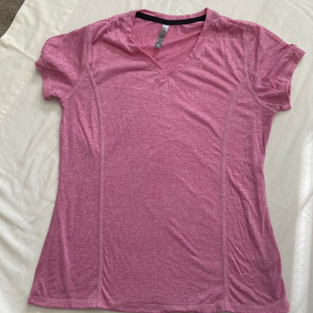 Gently used Women’s size medium OMT Active workout tee.
